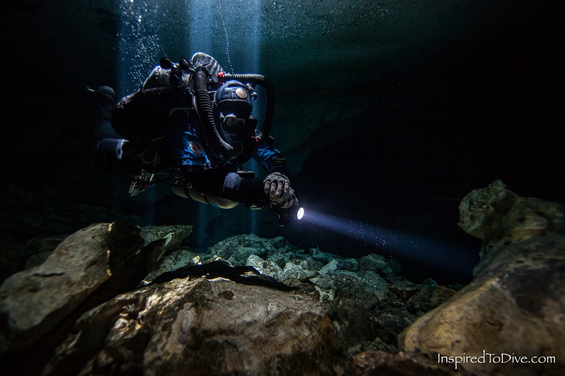 Scuber diver in a cave with a semi closed circuit rebreather the Halcyon RB80