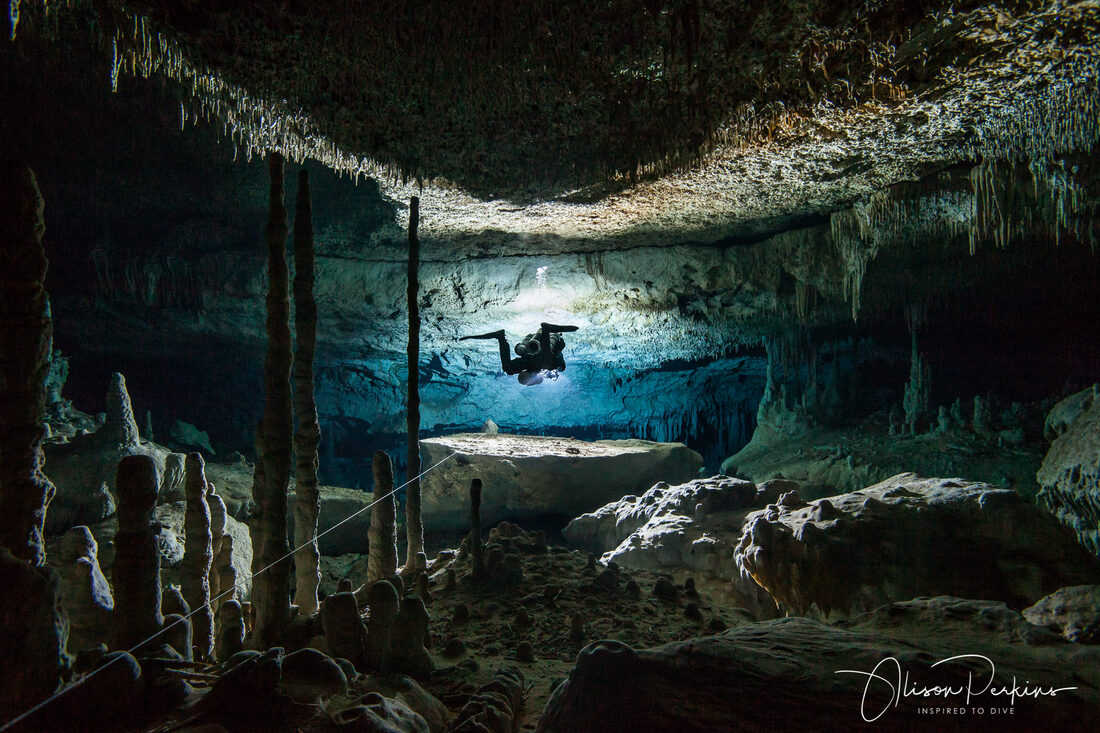 A cave diver travels the line in cave system Sac Actun