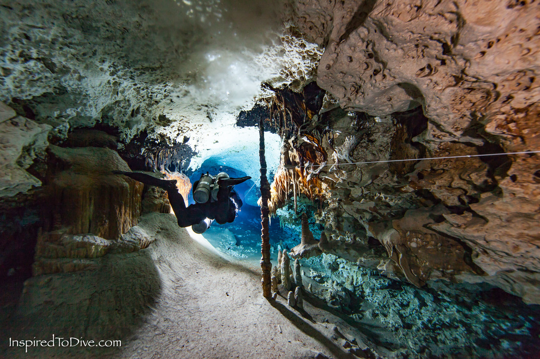 Cave diver in decorated tunnel in Mexico
