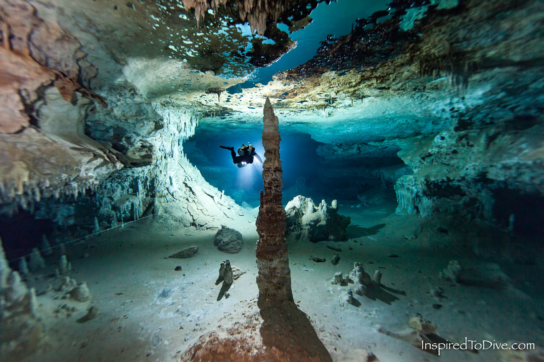 Cave diver with monolith formation in Cenote Otoch Ha