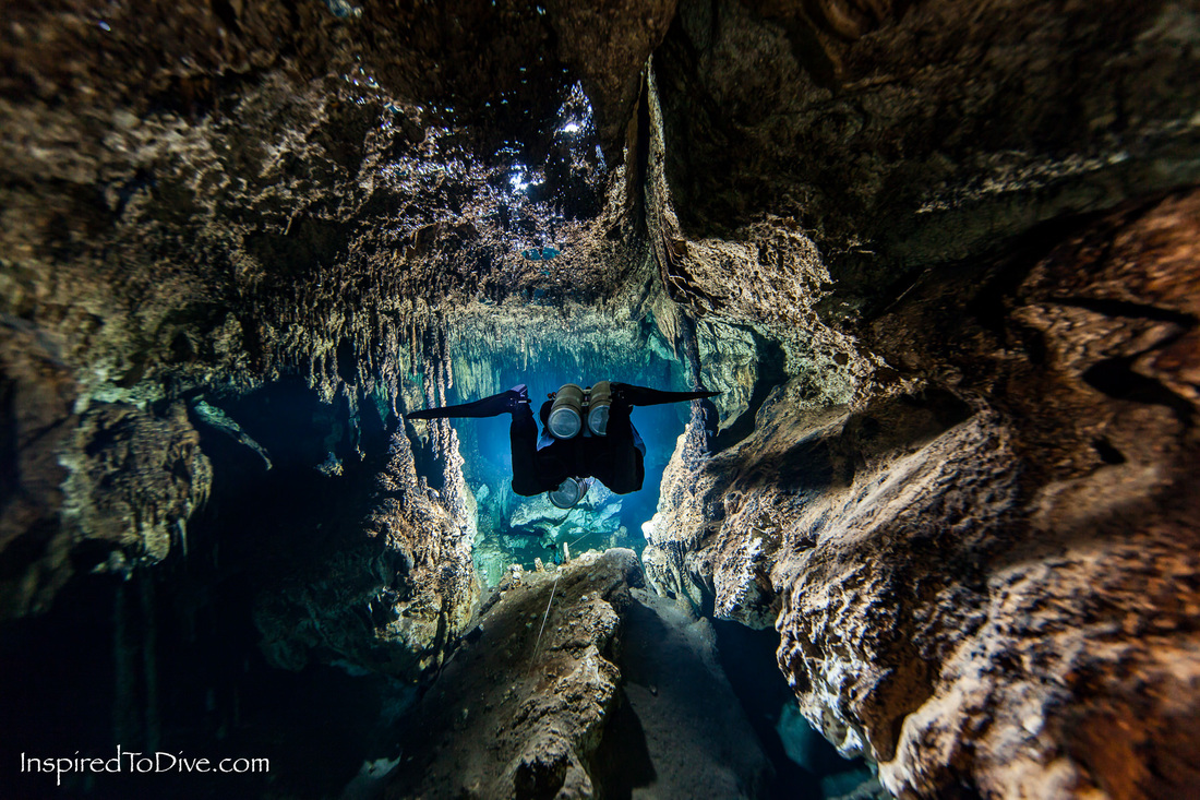 Cave diver inside an underwater tunnel in Cenote Vaca Ha in Mexico